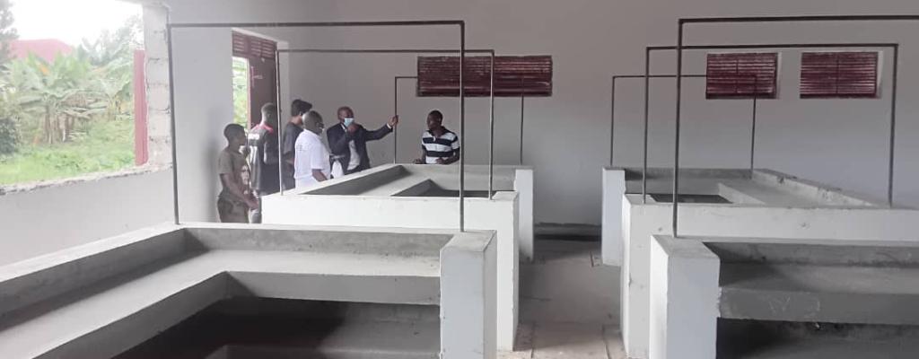 District Chairperson Inspecting the newly constructed Busunga Market funded by agriled, Thank you Government of Uganda and Long Live NRM BUSUNGA MARKET